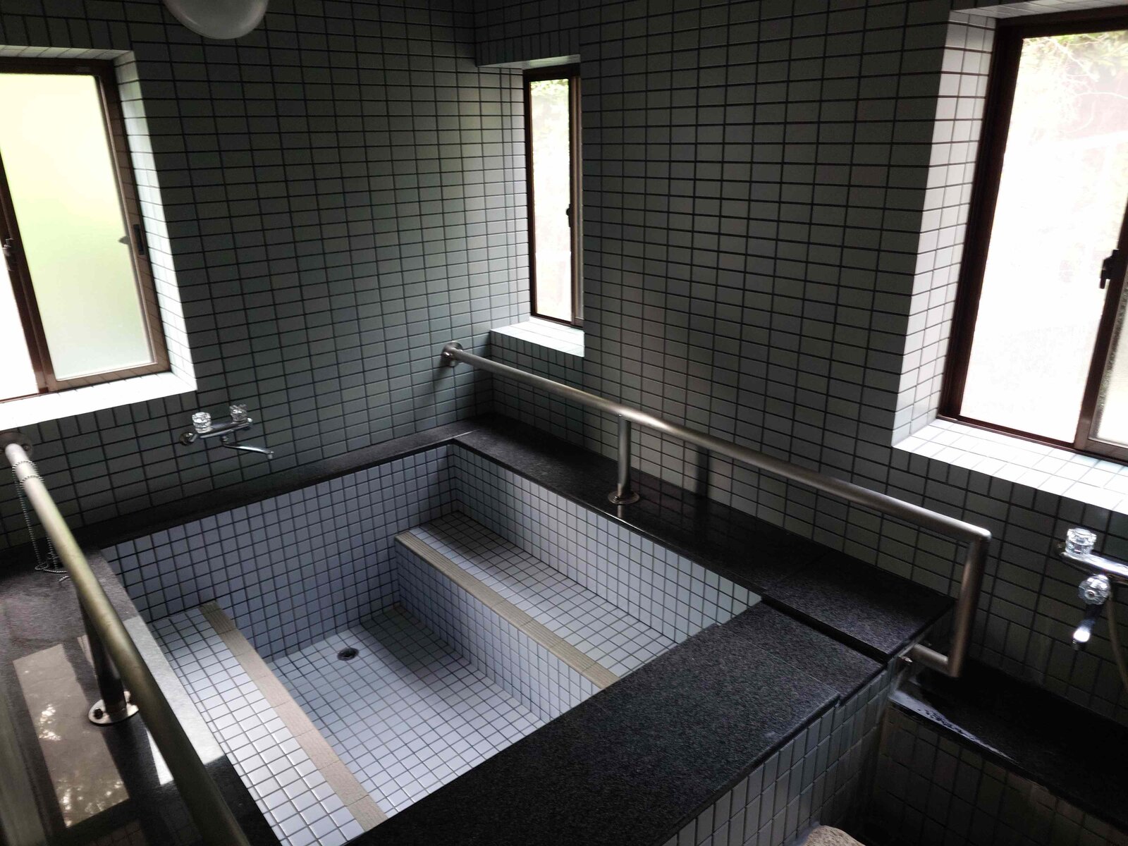Natural spring water bath at Guest House Kurotaki